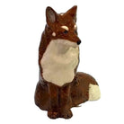 Fox figurine on a white background
