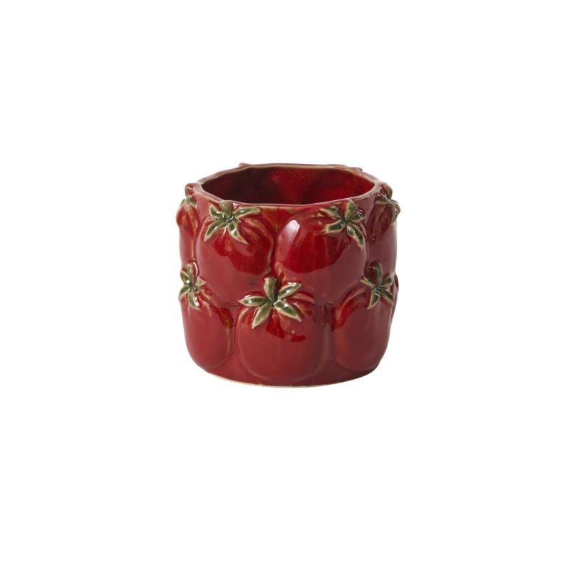 Red ceramic container with gold leaf designs on a white background
