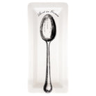 Silver spoon on a white card with 'Rest in Peace' text