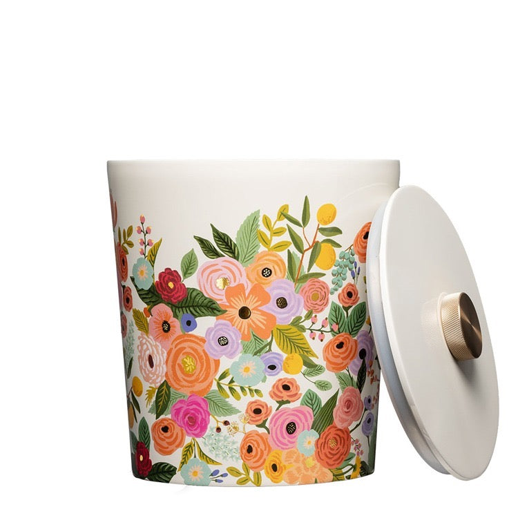 Decorative trash can with floral pattern on a white background