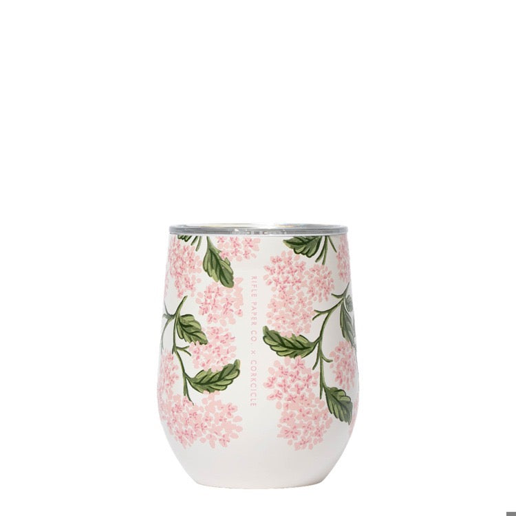 Stemless wine glass with floral pattern on a white background