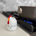 Chicken-shaped kitchen timer on a stove