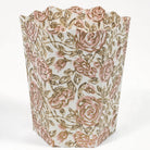 Floral-patterned waste bin with pink and brown roses on a white background