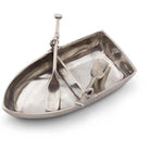Metallic boat-shaped container with utensils on a white background