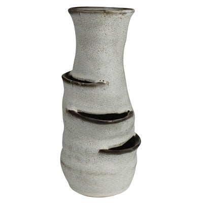 A handmade ceramic planter with a textured, speckled off-white glaze and dark brown unglazed terraced tiers, shown against a plain white background.