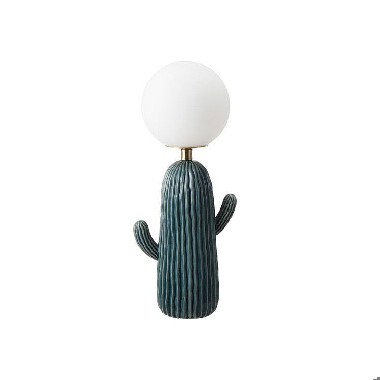 Cactus-shaped lamp with a white globe on a white background