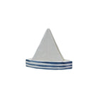 Model sailboat with a white sail and blue stripes on a white background