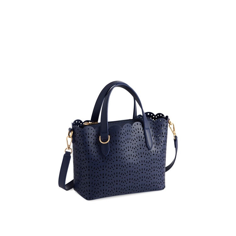 Navy blue handbag with perforated design on a white background