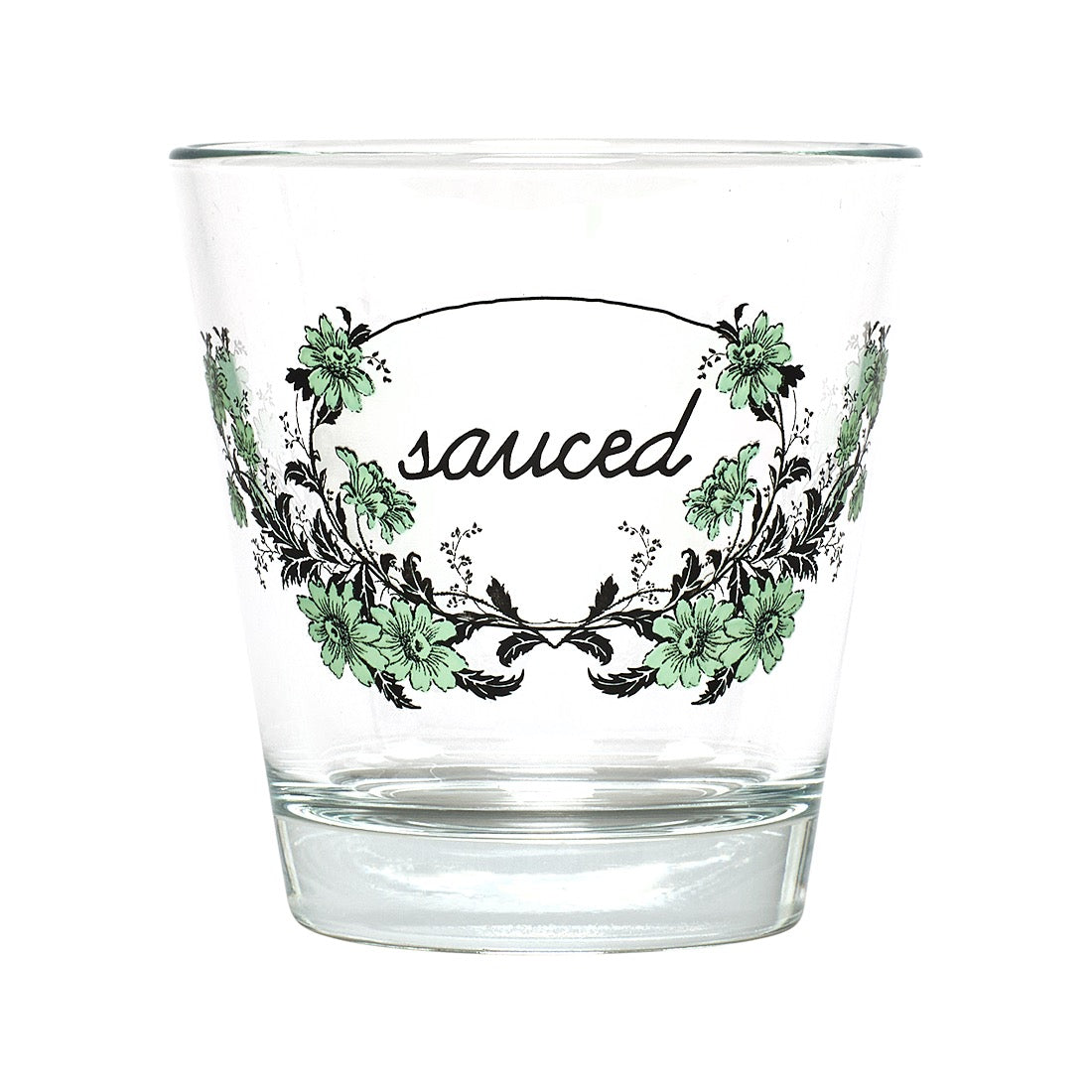 A clear glass tumbler with a printed floral wreath design and the word 'sauced' in black script across the front, shown on a plain white background.