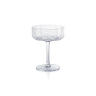 A clear glass coupe or champagne flute with a flared, scalloped rim, a slender stem, and a round base, shown on a plain white background.