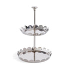 Two-tiered metal stand with decorative edge on a white background