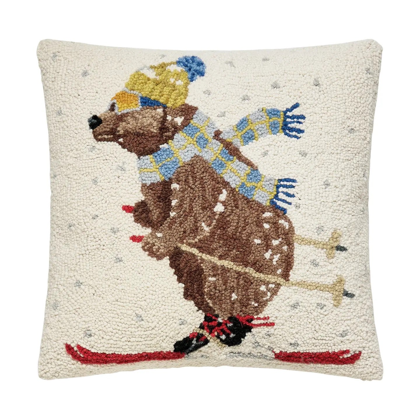 Decorative pillow with a bear skiing design on a white background
