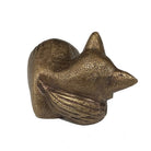 Bronze fox figurine on a white background