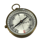 Vintage-style compass with brass casing on a white background