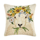 Decorative pillow with a goat face design and floral wreath on a white background