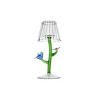 Decorative lamp with a green stem and clear glass shade on a white background