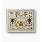 A square baby keepsake album with a cream-colored cover and a detailed, colorful embroidered-style illustration of a nursery scene featuring a teddy bear, giraffes, trees, and a swan. The text 'Save the Little One' is embroidered in the center.