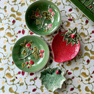 Decorative ceramic plates with floral designs on a patterned surface