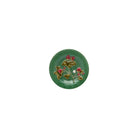 Decorative green plate with floral design on a white background