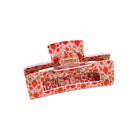 Hair clip with strawberry pattern on a beige background