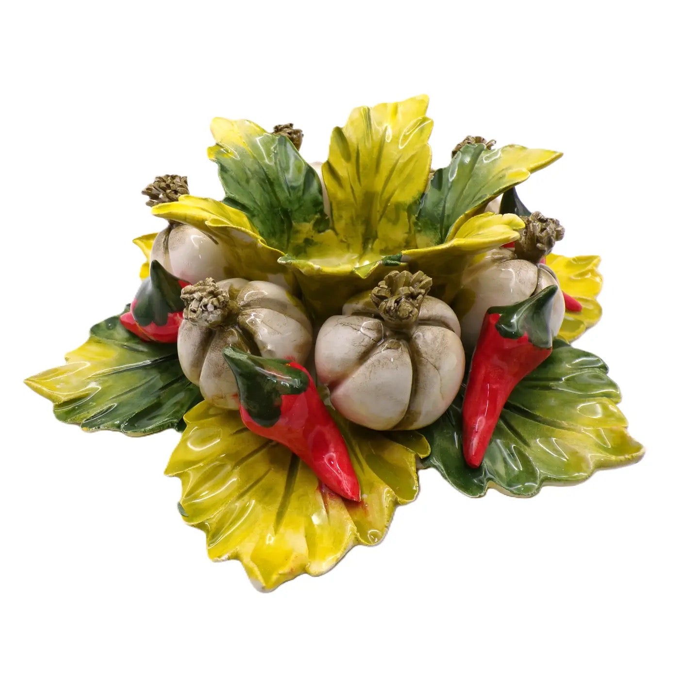 Decorative ceramic wreath with pumpkins, leaves, and peppers on a white background