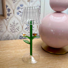 Small decorative lamp with floral design on a wooden surface