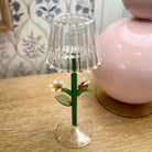 Small decorative lamp with a floral design on a wooden surface