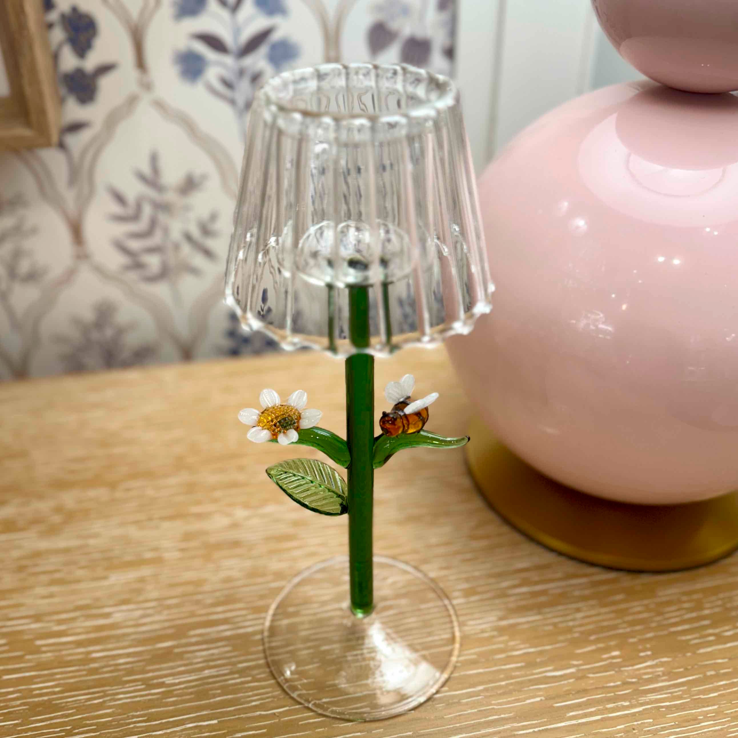 Small decorative lamp with a floral design on a wooden surface