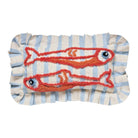 Decorative pillow with red fish design on a striped background