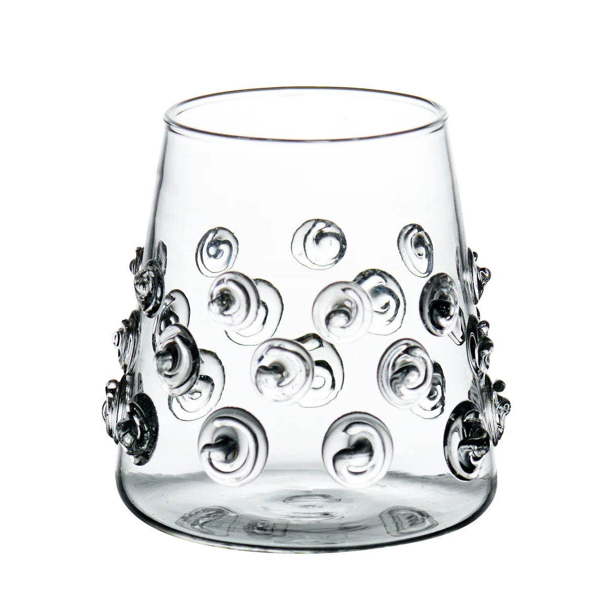 Clear glass with decorative patterns on a white background