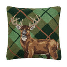 Decorative pillow with a deer design on a green plaid background