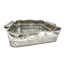 Silver decorative basket with intricate patterns on a white background