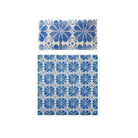Blue floral patterned bedding set on a white background