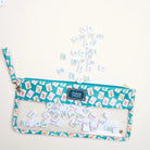Set of colorful tiles with a blue pouch on a white background