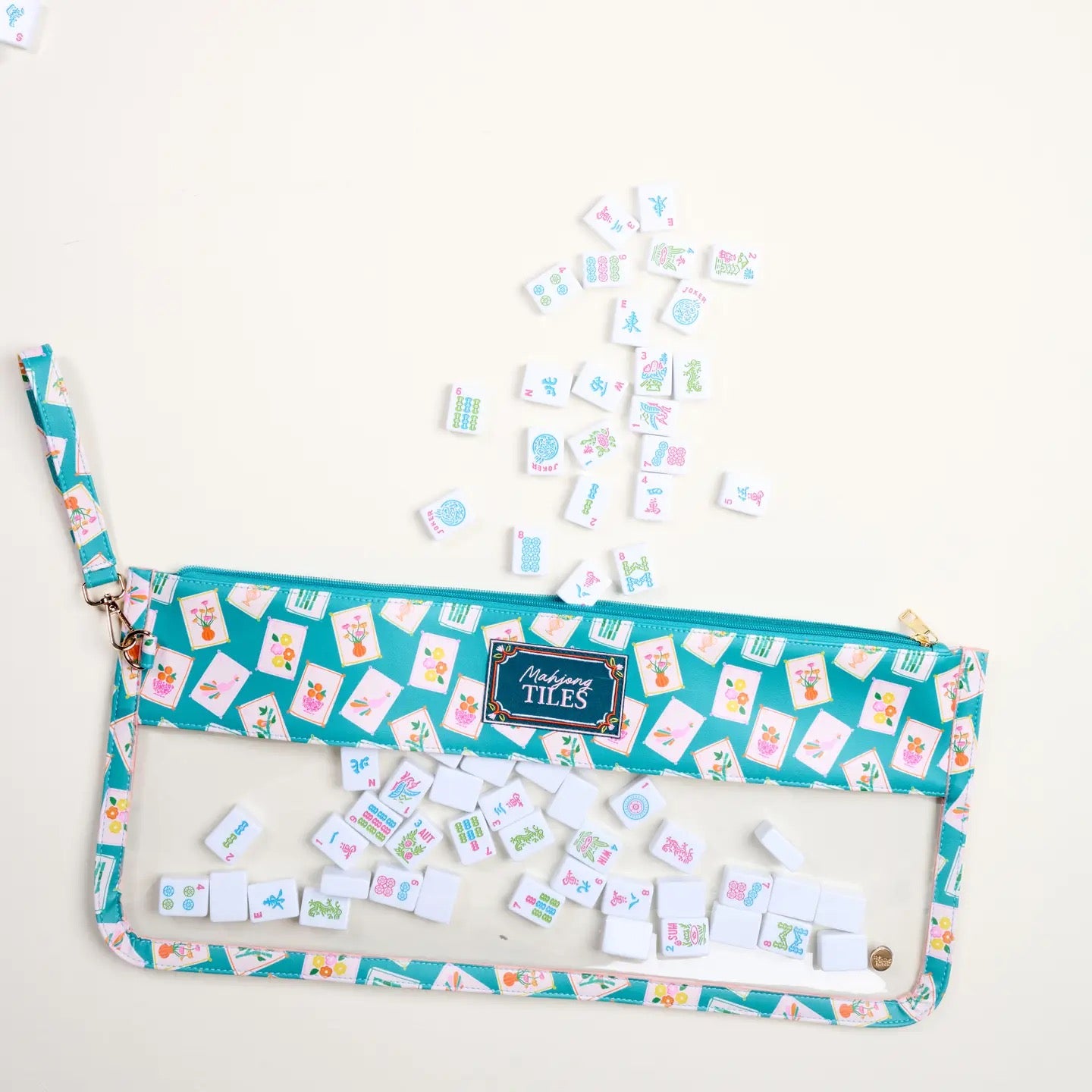 Set of colorful tiles with a blue pouch on a white background