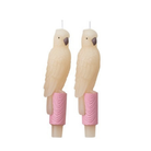 Two parrot-shaped candles with pink bases on a white background