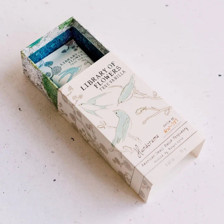 Box of 'Library of Flowers' soap with floral design on a light background