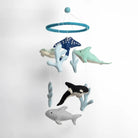 Plush ocean-themed mobile with various sea creatures on a white background