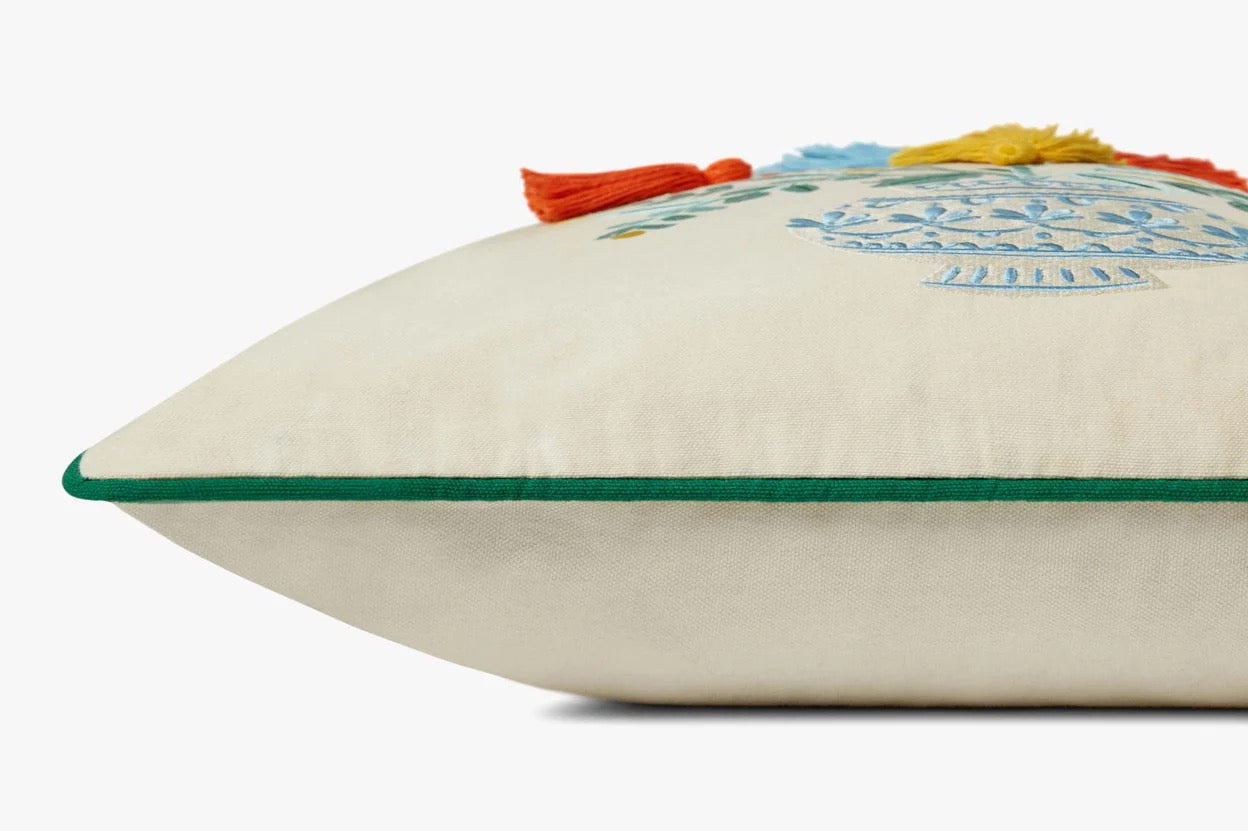 Decorative pillow with colorful tassels on a white background