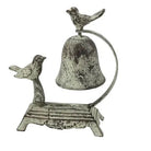 Decorative metal bell with birds on a white background