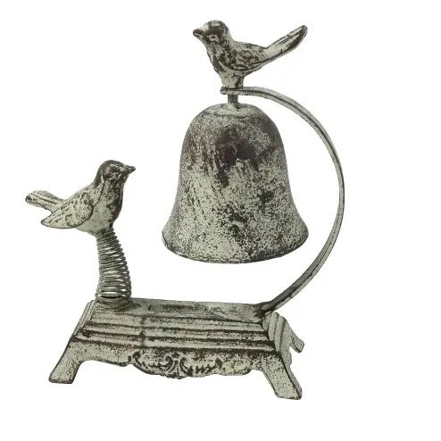 Decorative metal bell with birds on a white background
