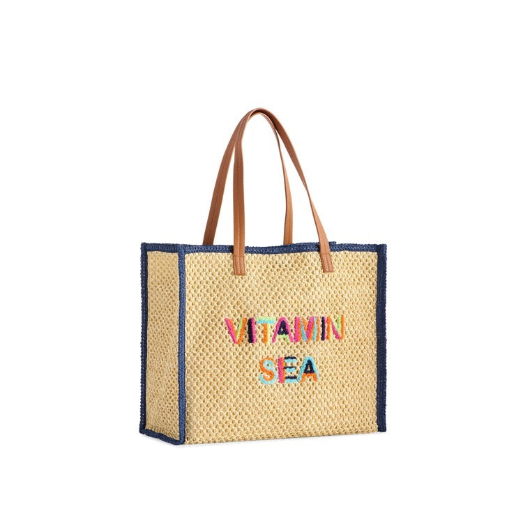 Woven tote bag with colorful text on a white background