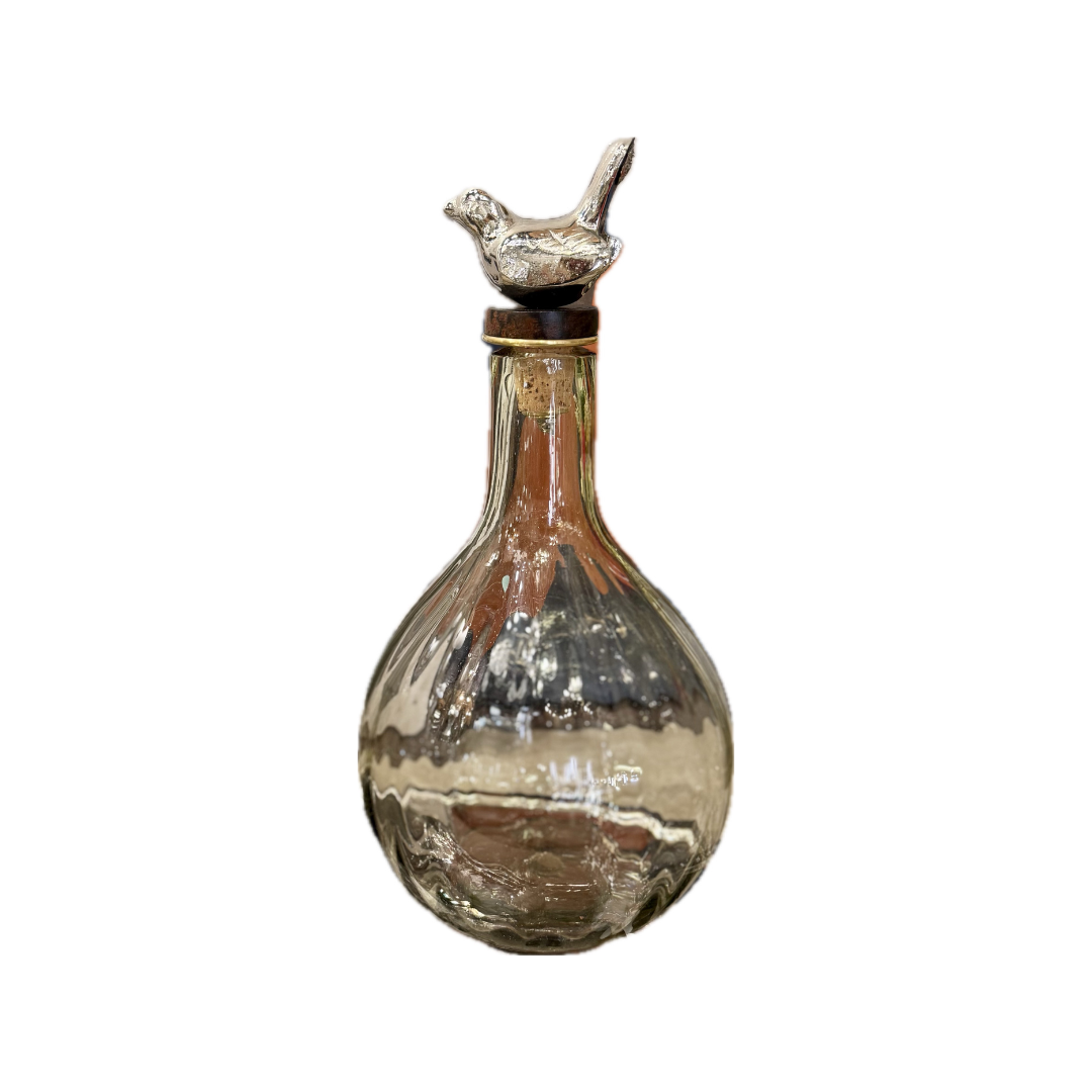 Decorative glass bottle with a silver cap on a white background