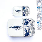 Two square containers with whale and floral designs on a white background