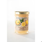 Savannah Bee Company candle with lemon design on a white background