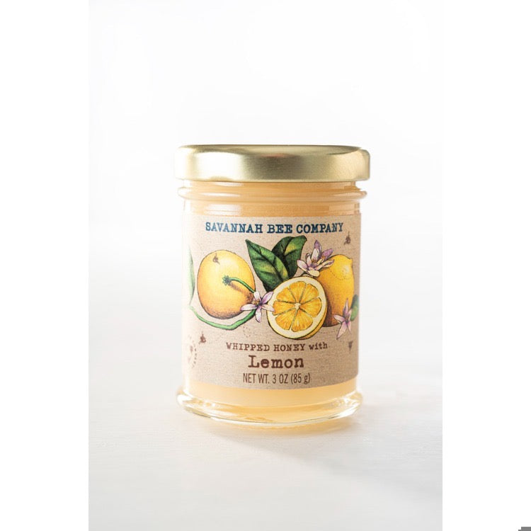 Savannah Bee Company candle with lemon design on a white background
