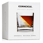 Corkcicle whiskey wedge packaging with a glass of whiskey on a white background