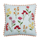 Decorative pillow with floral embroidery on a striped background
