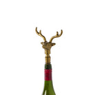 Brass deer head bottle stopper on a white background
