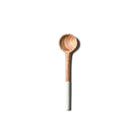 Wooden spoon with a white handle on a white background